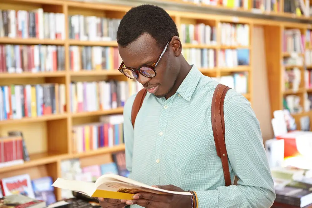 male reading a book